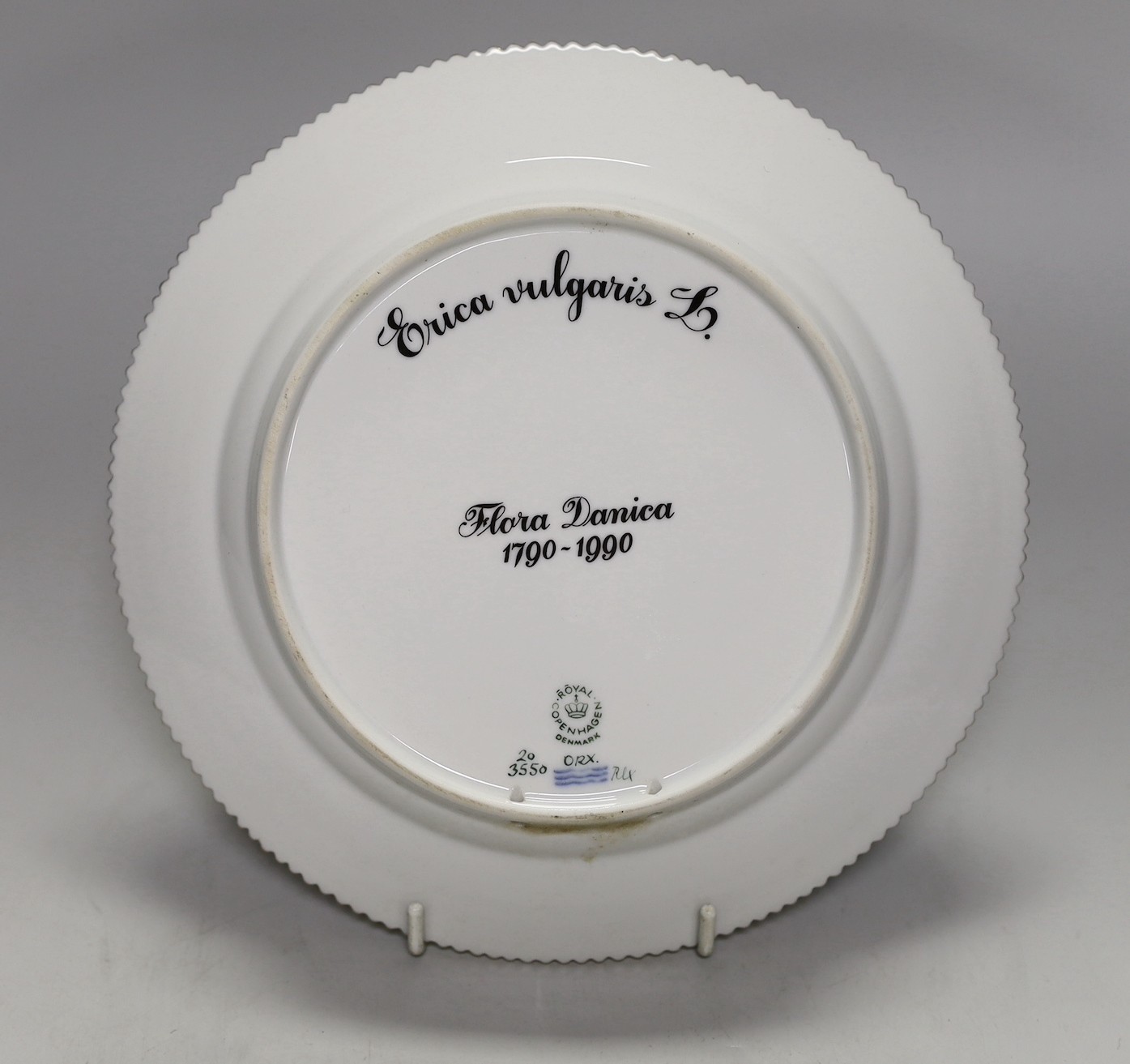 A Royal Copenhagen Flora Danica plate painted with Erica Vulgaris, titled, 22cm